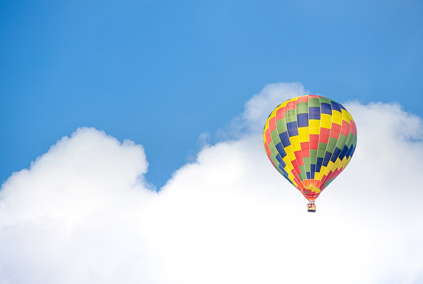 Colorful Hot Air Balloon Flying in Blue Sky