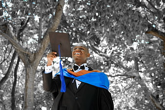 Happy African American Graduate Throwing Cap in Joyful Celebration