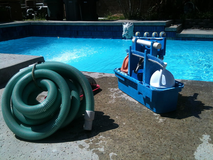 Pool cleaning equipment and vacuum hose by swimming pool