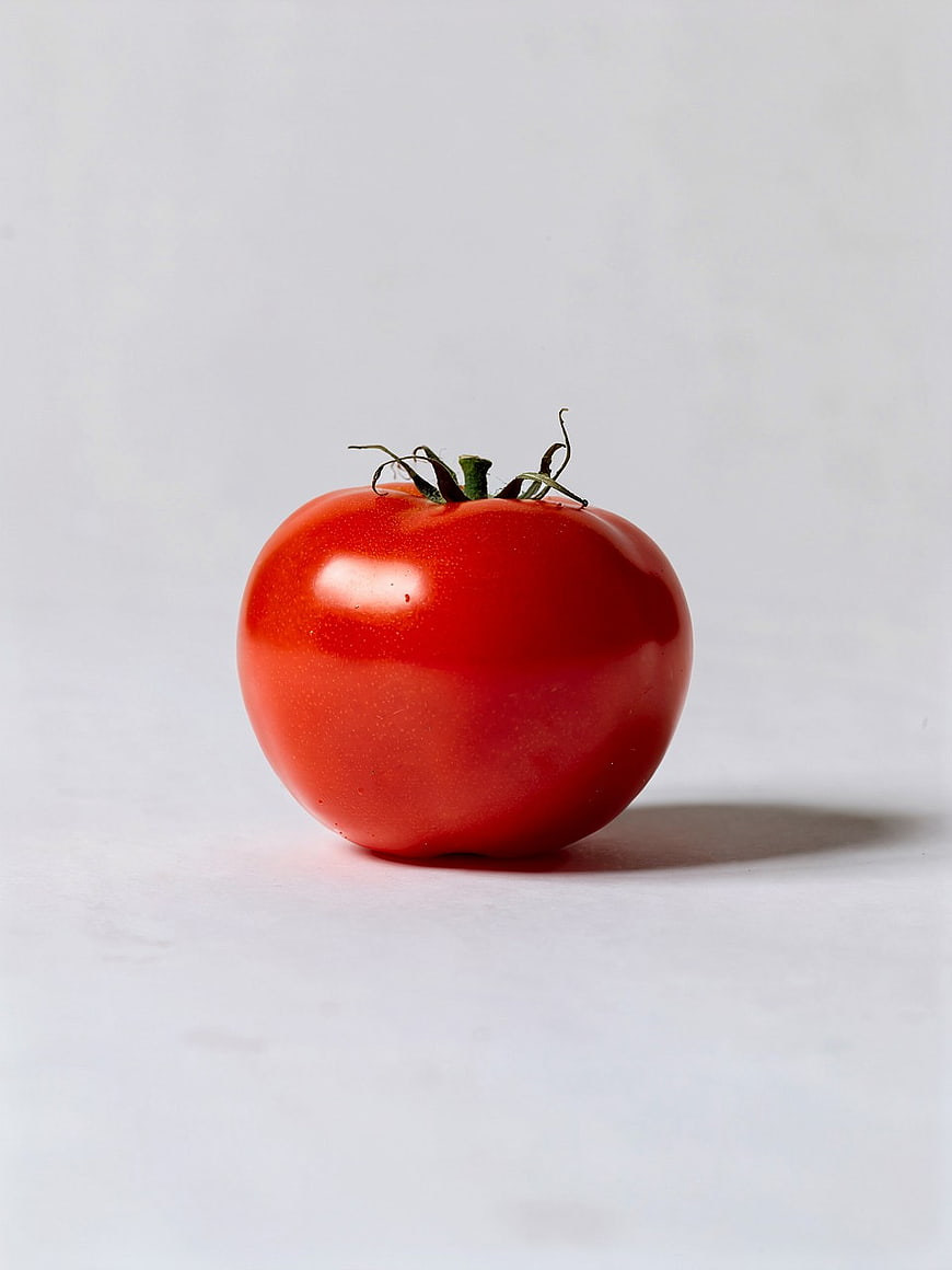 Single Fresh Red Tomato on White Background