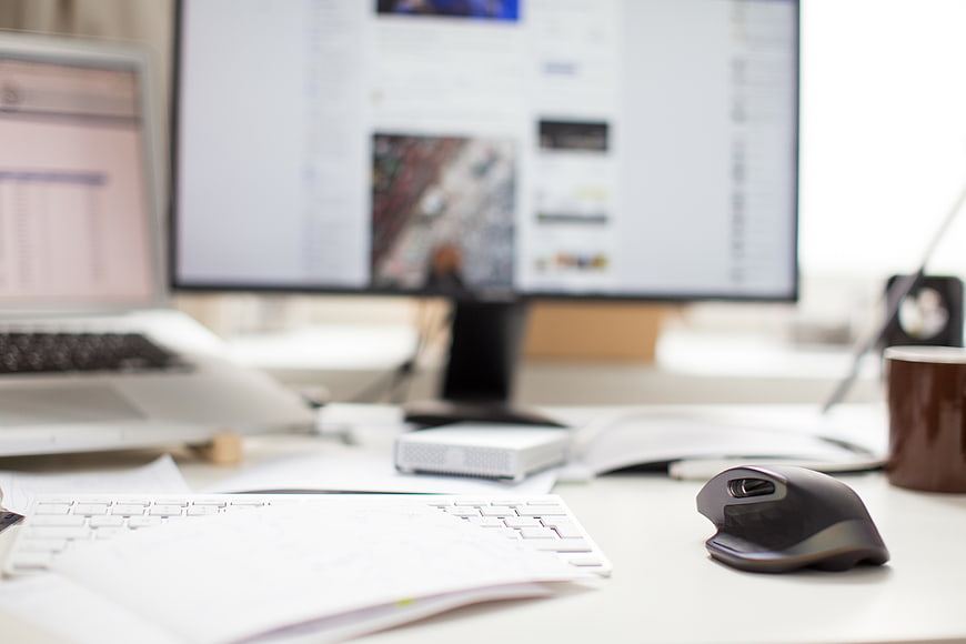 Modern Office Workspace with Laptop and Monitor