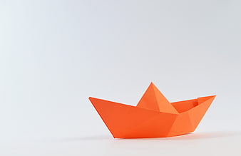 Orange Origami Paper Boat on White Background