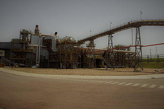 Industrial factory plant with conveyor belt and machinery