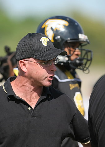 Football Coach Giving Instructions on the Field