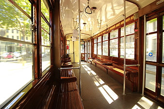 Sunlit Interior of Vintage Wooden Tram Car