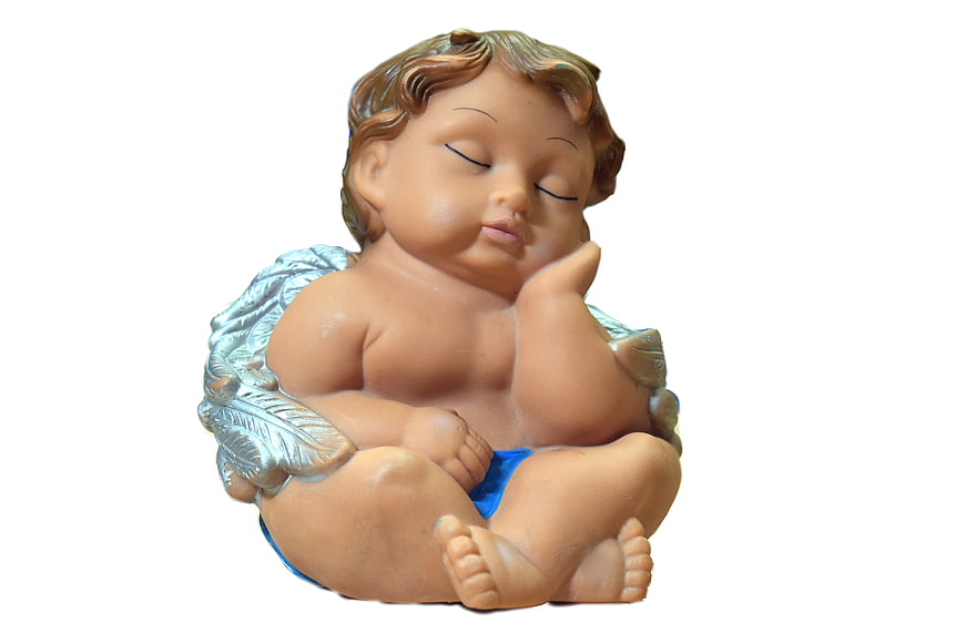 Sleeping cherub figurine with silver wings on white background