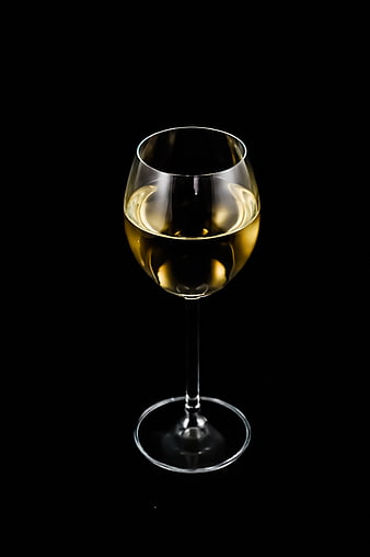 Glass of White Wine on Black Background