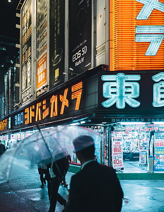 Rainy Night Street Scene in Tokyo with Neon Signs