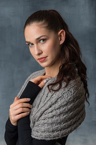 Studio Portrait of Young Woman Wearing Knitted Shawl