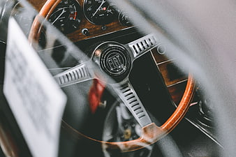 Vintage Fiat Steering Wheel and Dashboard Interior Close-Up