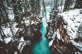 Aerial View of Turquoise River in Snowy Canyon
