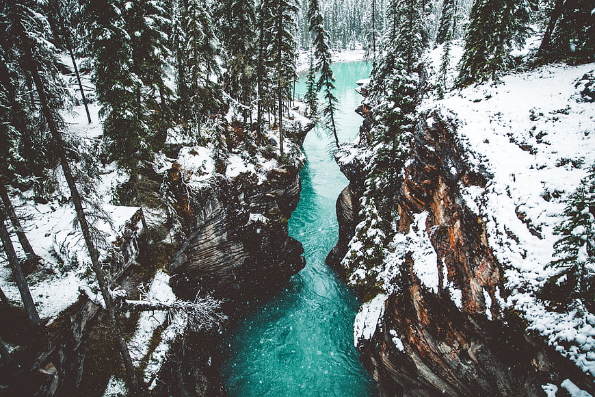 Aerial View of Turquoise River in Snowy Canyon