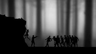 Silhouette of survivors fighting zombie horde in dark forest