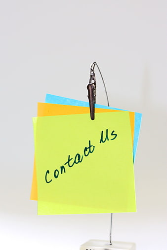 Colorful Sticky Notes With Contact Us Text Hanging On Wire