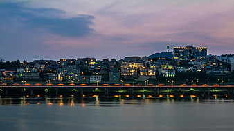 Seoul Cityscape at Dusk with Namsan Tower and River Reflections