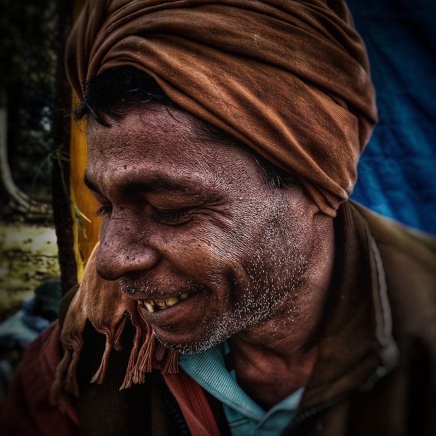 Close-up portrait of smiling man with turban