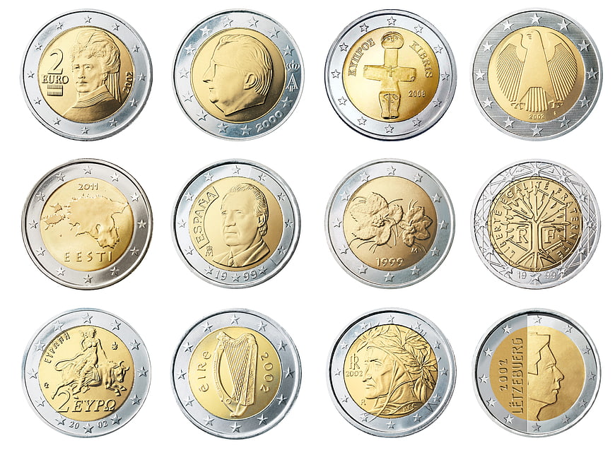 Collection of various European 2 Euro coins on white background