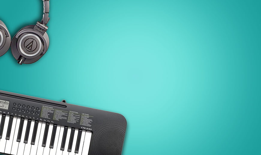 Black Keyboard and Headphones on Teal Background