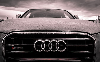 Close-up of Wet Audi S5 Front Grille in Rain