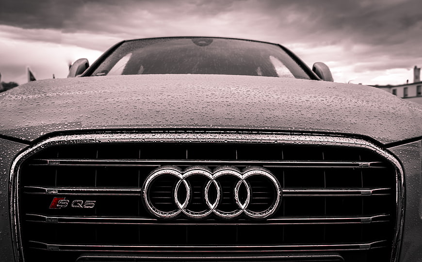 Close-up of Wet Audi S5 Front Grille in Rain