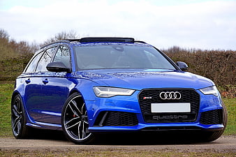 Blue Audi RS6 Avant Station Wagon Parked On Gravel Road