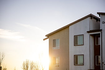 Modern Apartment Building Facade at Sunset with Copy Space