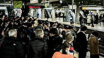 Crowded Japanese Train Station Platform at Night
