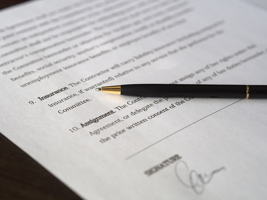 Black pen on signed legal contract document