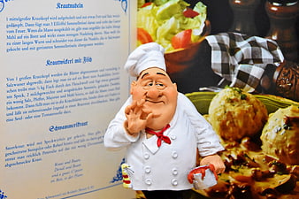 Chef Figurine With German Cookbook And Traditional Food