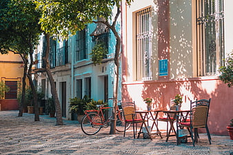 Colorful European Street Scene with Cafe and Bicycle