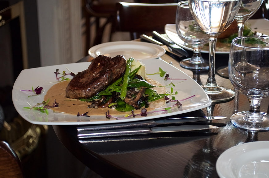 Gourmet Steak Dinner with Vegetables in Upscale Restaurant