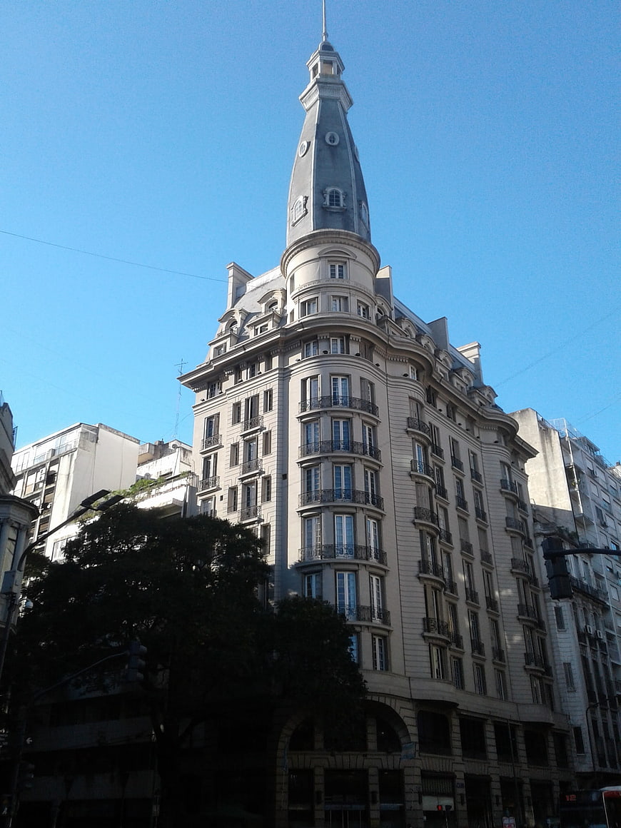 Low angle view of historic Parisian building with mansard roof