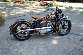 Vintage Indian Motorcycle with Gold Pinstriping on Pavement