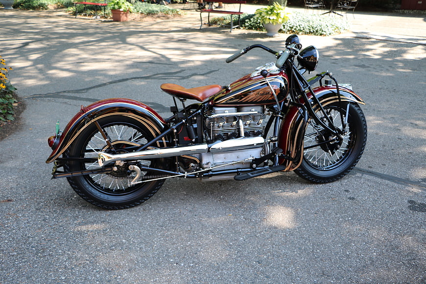Vintage Indian Motorcycle with Gold Pinstriping on Pavement
