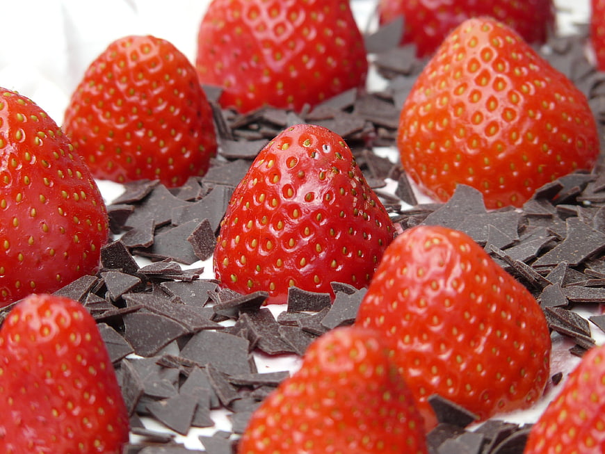 Fresh Strawberries with Dark Chocolate Shavings on White Background