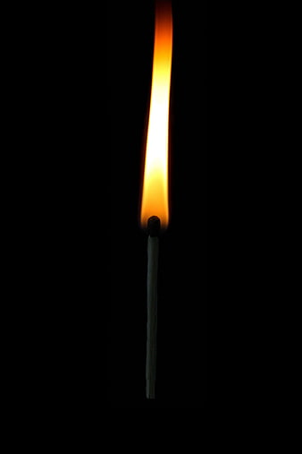 Lit Match Flame Against Black Background