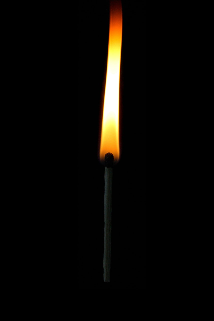 Lit Match Flame Against Black Background