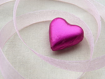 Pink Foil Heart Chocolate with Ribbon on Fabric