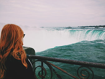 Woman with Red Hair Viewing Niagara Falls