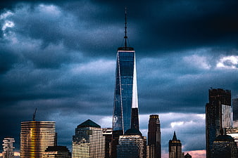 Dramatic One World Trade Center Skyline Under Stormy Clouds