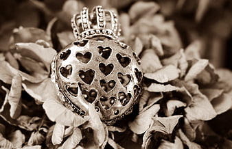 Vintage silver heart locket on dried flowers