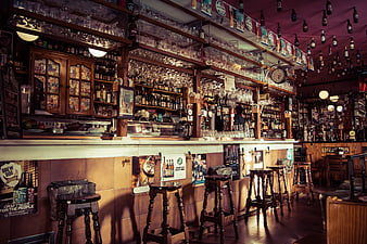 Empty Traditional Pub Interior with Wooden Bar and Stools