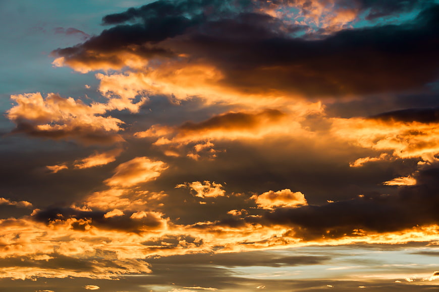 Dramatic Golden Sunset Sky with Dark Clouds