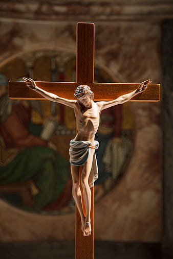 Wooden Crucifix with Jesus Figure in Church Interior