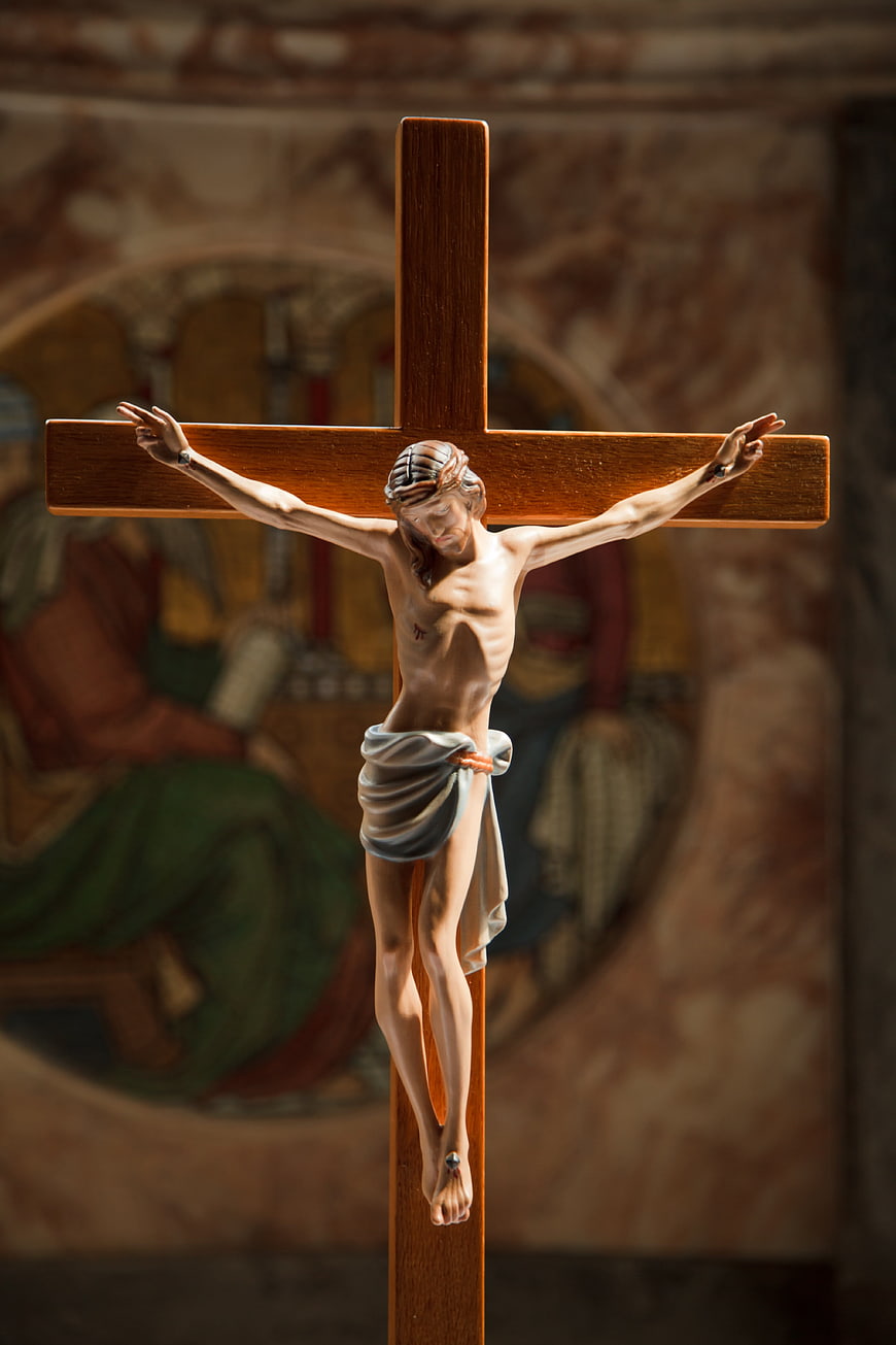 Wooden Crucifix with Jesus Figure in Church Interior
