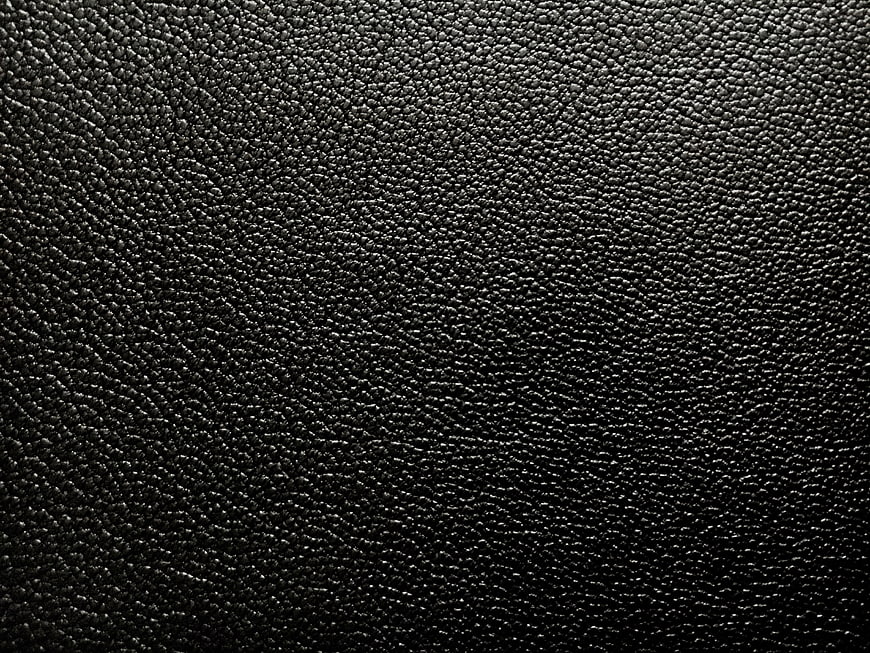 Close-up of black textured leather surface background
