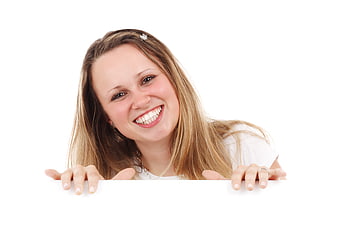 Happy woman holding blank white sign with copy space