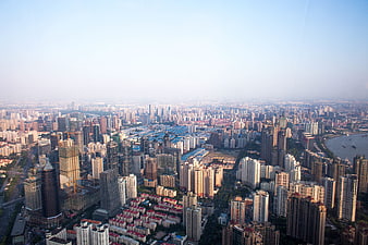 Aerial View of Dense Urban Cityscape with River
