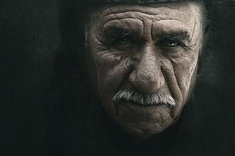 Dramatic Close-Up Portrait Of An Elderly Man With Intense Gaze