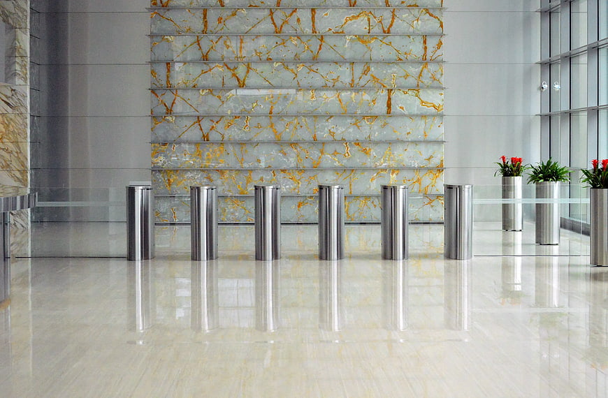 Modern luxury lobby with marble wall and stainless steel bollards